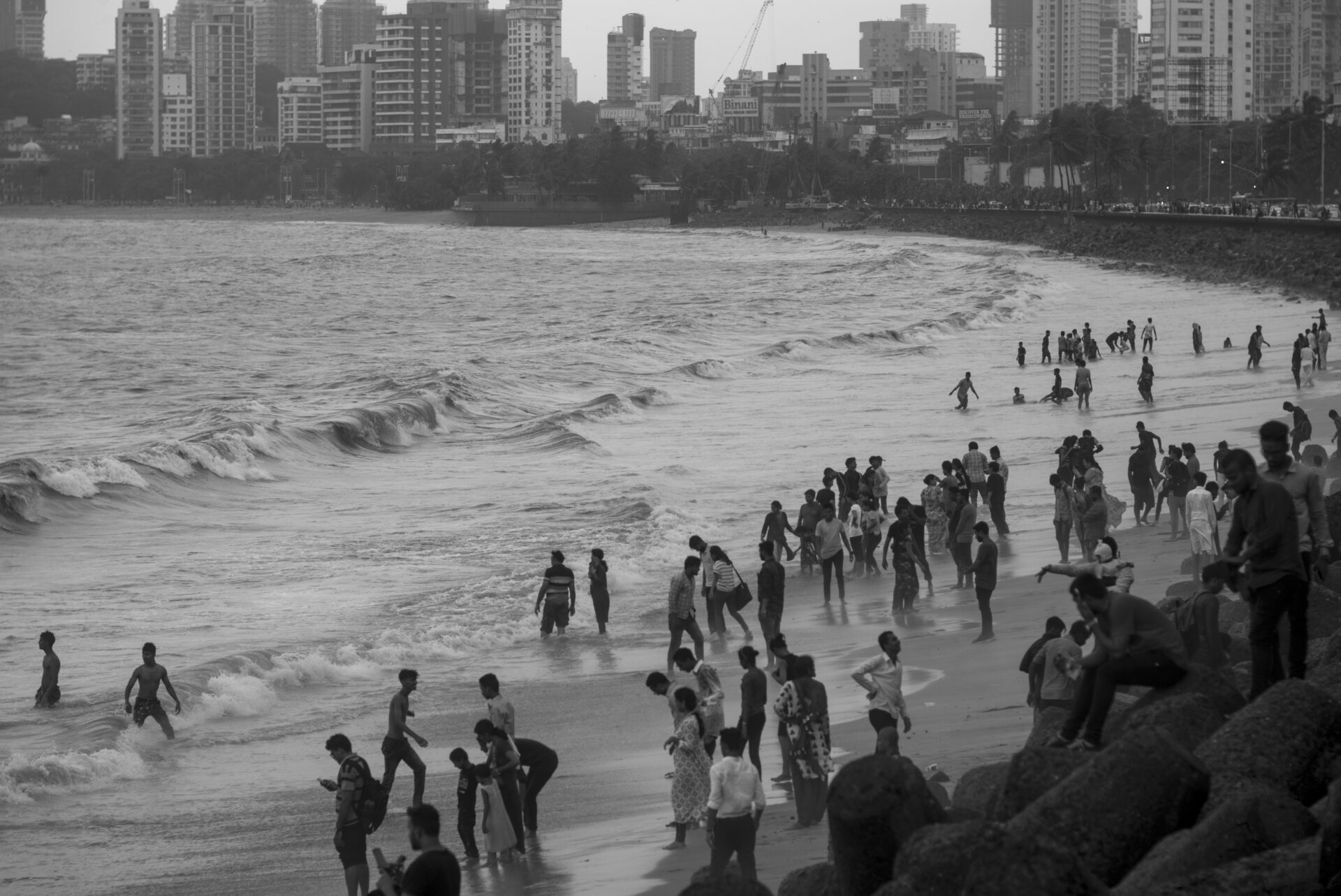 Photographer Sunhil Sippy on Mumbai | People on the beach fully clothed, wandering in and out of the sea