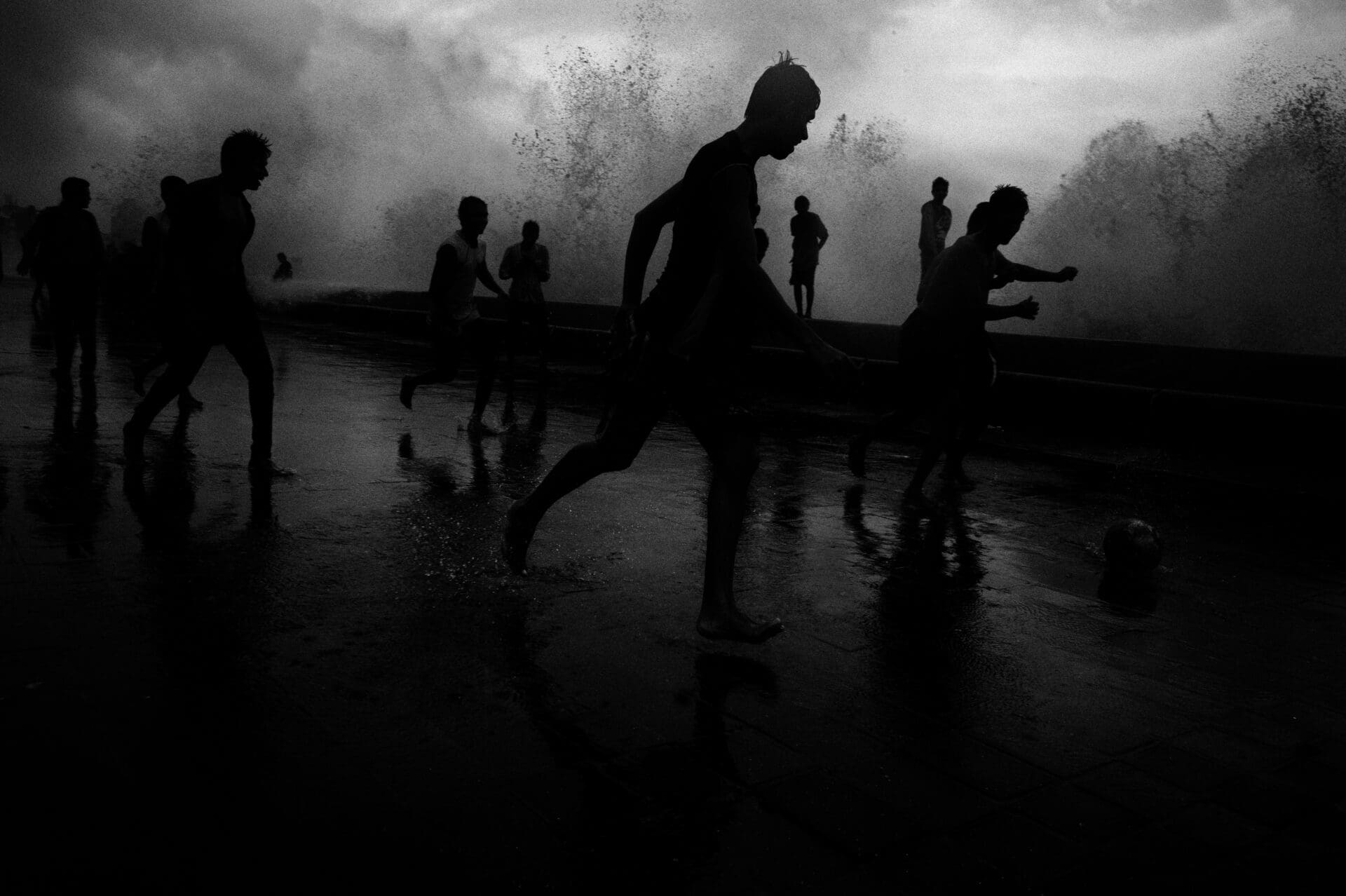 Photographer Sunhil Sippy on Mumbai | dark figures frolic in watery spray, photographed in black and white