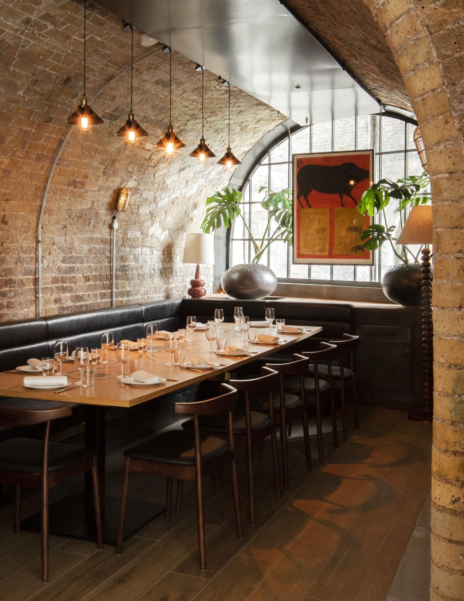 Best restaurants in London Bridge and Borough | a table under an arch, with a curved window at the end