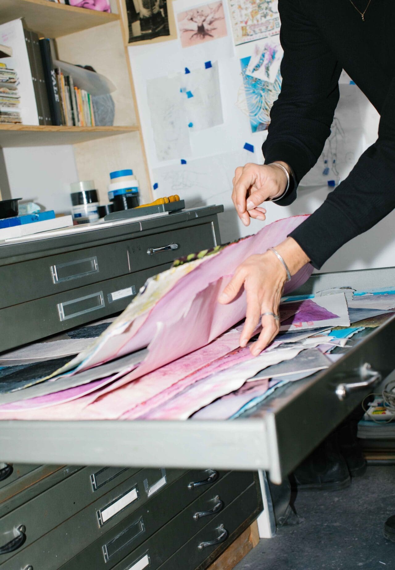 Felipe Baeza | Searching through art works in a drawer in Felipe Baeza's studio