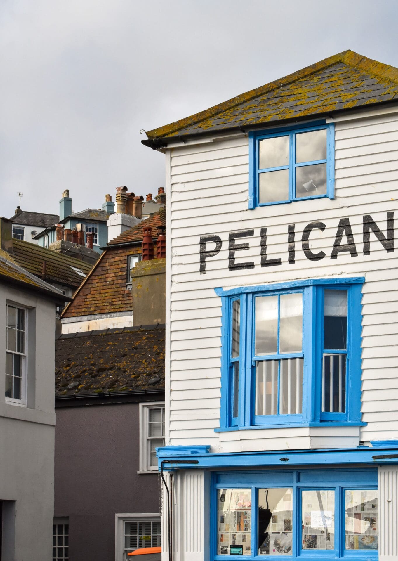 A weekend in Hastings | A clapboard house with blue painted window frames, with the word PELICAN written across it