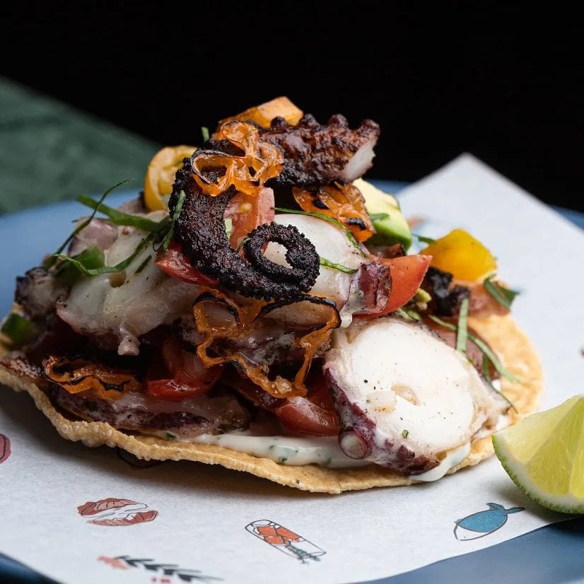 Best restaurants LA Arts District | A tostada piled high with seafood, including a crispy curl of octopus at La Cha Cha Cha