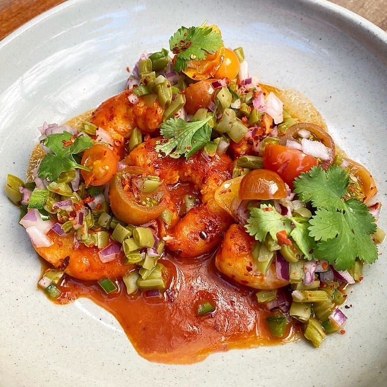 Best restaurants LA Arts District | a tomato salad with plenty of fresh herbs and spring onion