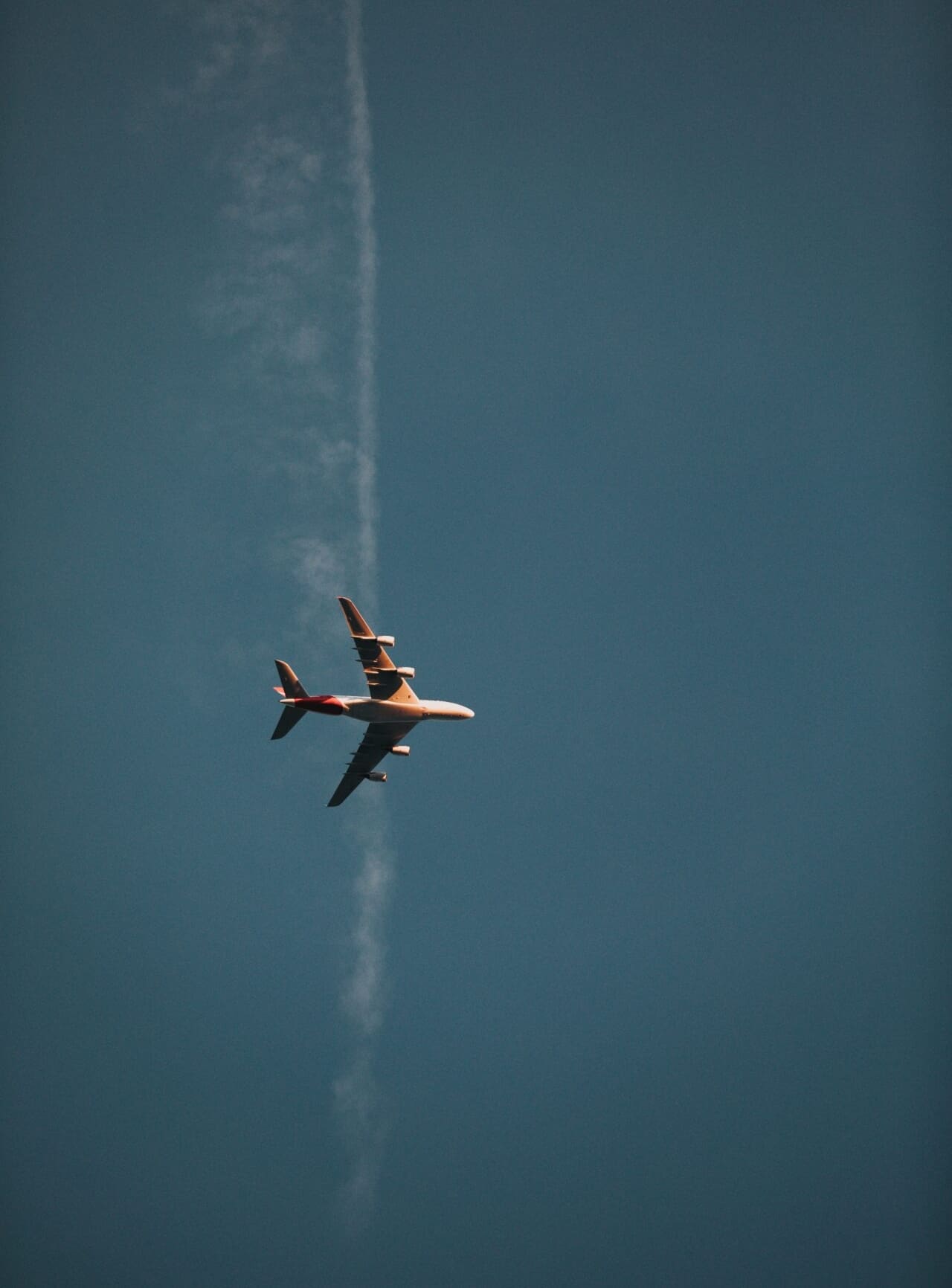 Airline news and trends | A plane shot from below against a blue sky