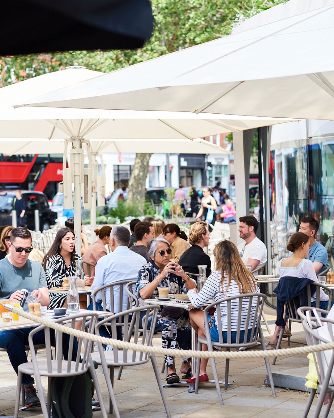 People enjoying coffee and drinks at Vardo on Duke of York Square in Chelsea