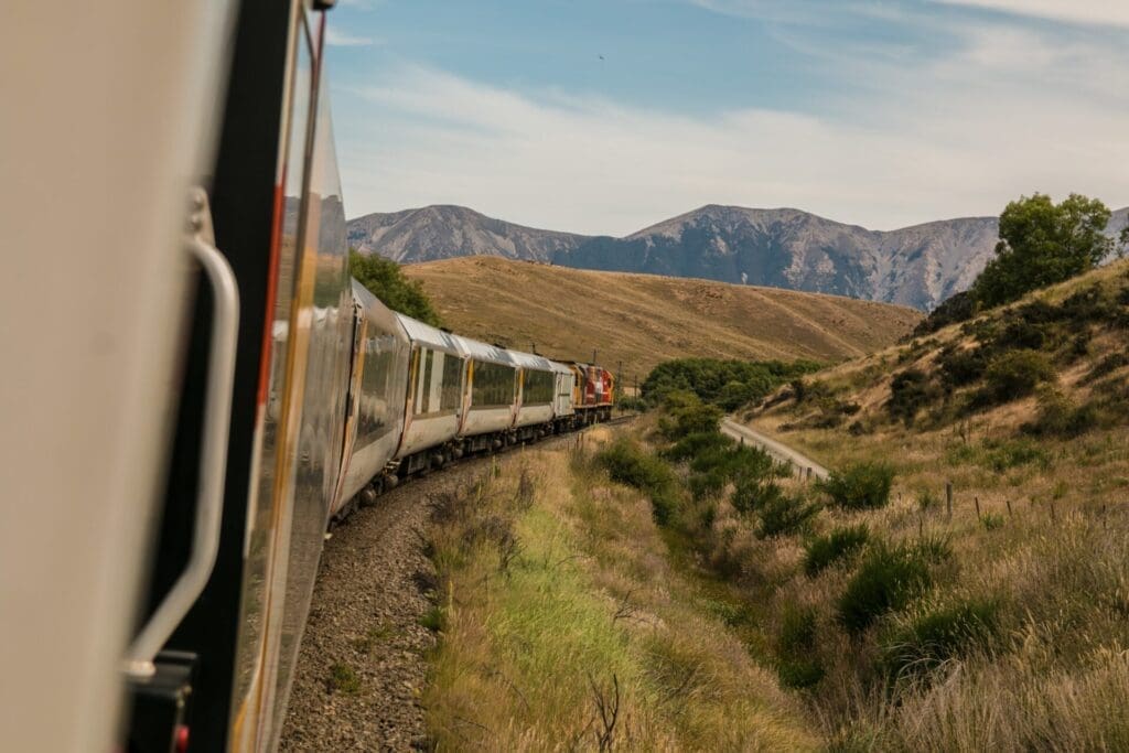 Train travel through Lake Geneva, Switzerland | A train moves through the hillside in Montreux