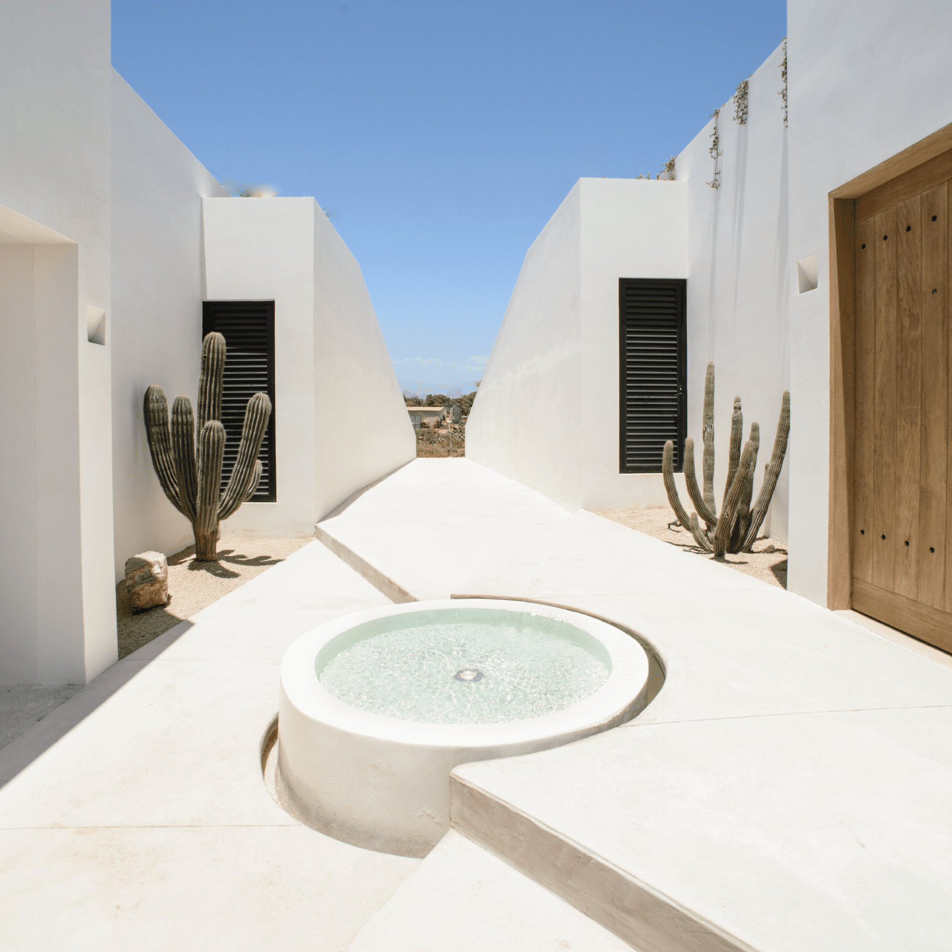 White villas beneath a blue sky at Rancho Pescadero, a sustainable resort in Mexico