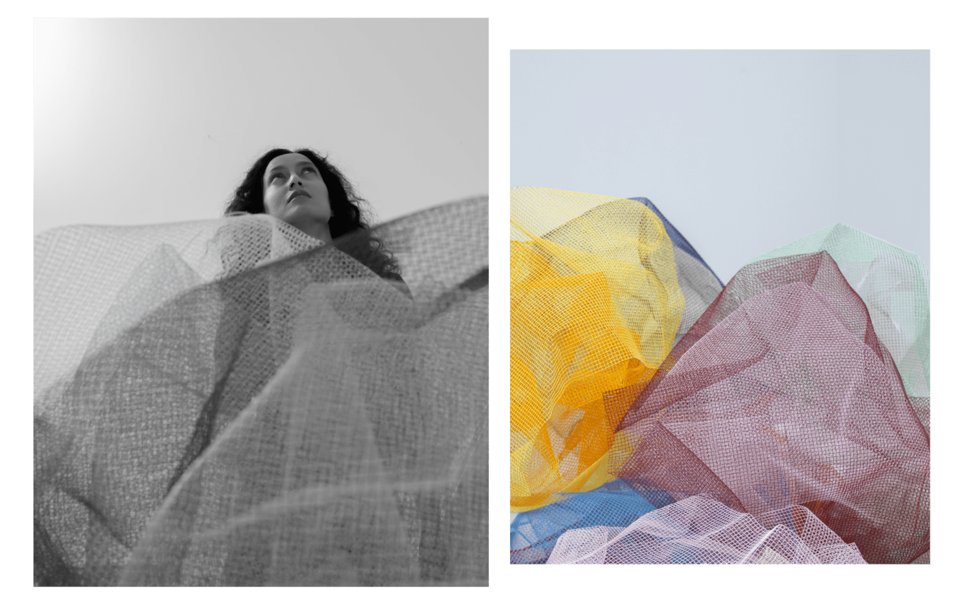 Artist Rana Begum, set against her brightly coloured, geometric metal mesh work
