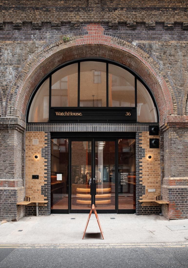 The exposed brick exterior of WatchHouse Roastery, set in a railway arch on Maltby Street, London