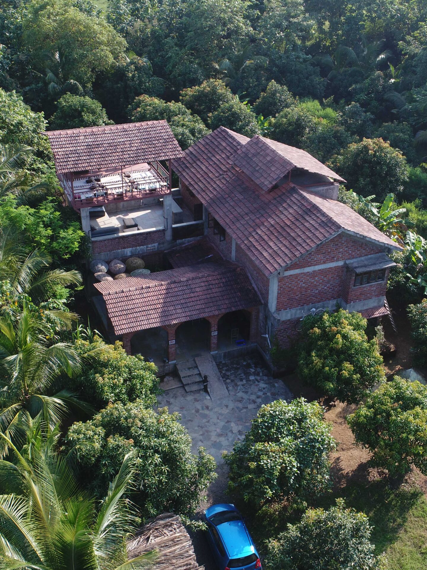The best farm stays outside of Mumbai | An aerial view of Arwa Farms, surrounded by forest