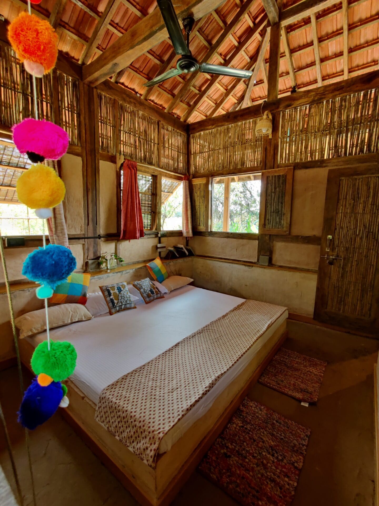 The best farm stays outside of Mumbai | A bedroom inside a private hut at Mohraan Farms