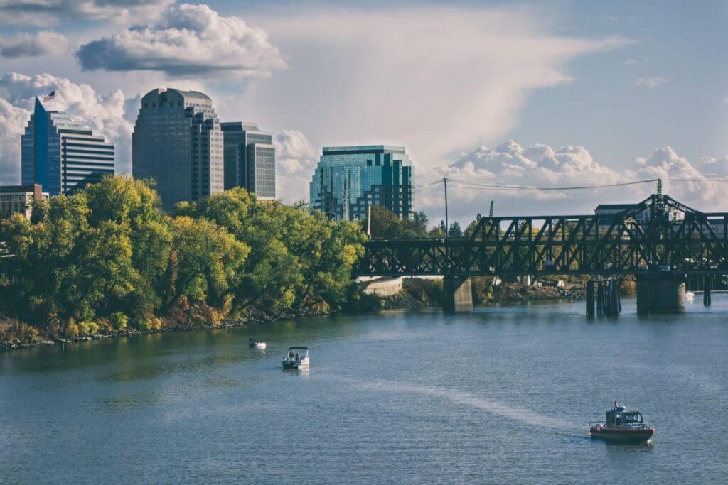 skyscrapers and trees against the river in Sacramento, California