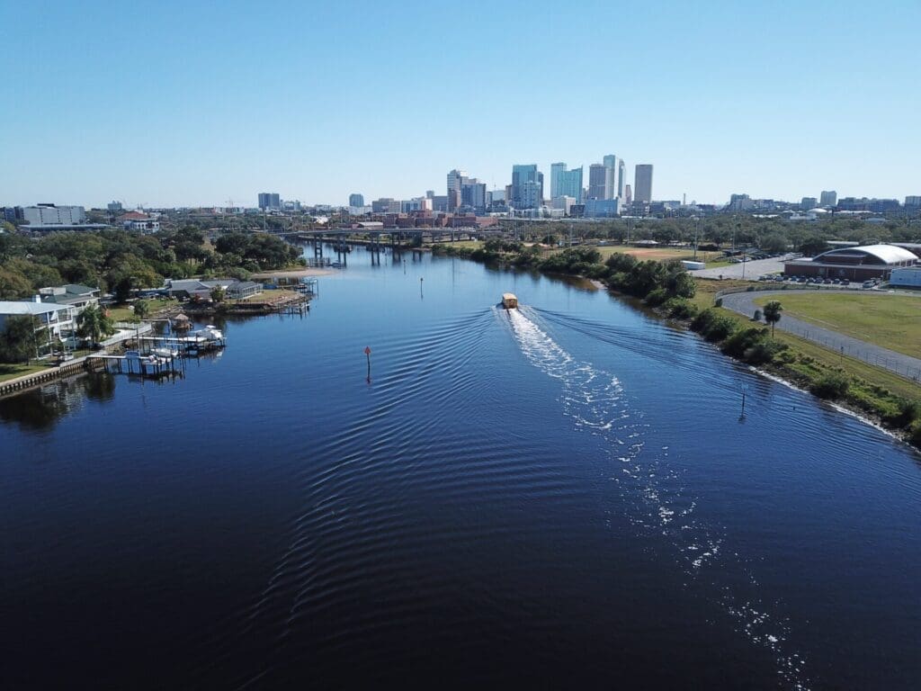 The piercing blue river in Tampa, Florida, with skyscrapers in the distance