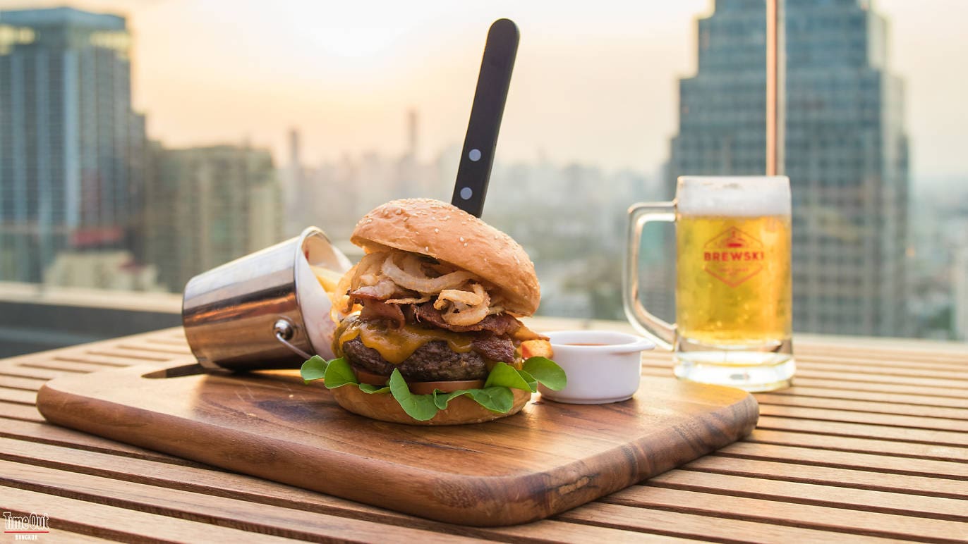 The best rooftop bars in Bangkok | a loaded burger at Brewski at Radisson Blu Plaza
