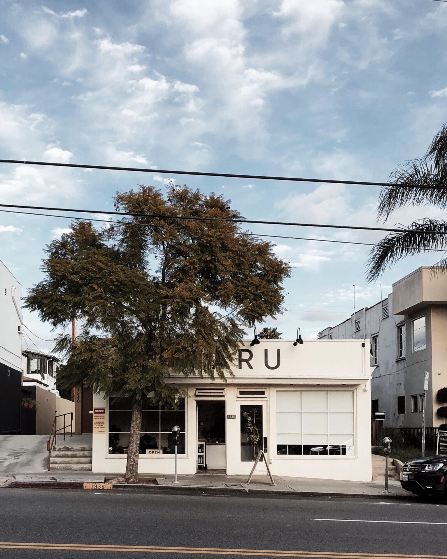 The exterior of Maru coffee beneath a blue sky in Los Angeles