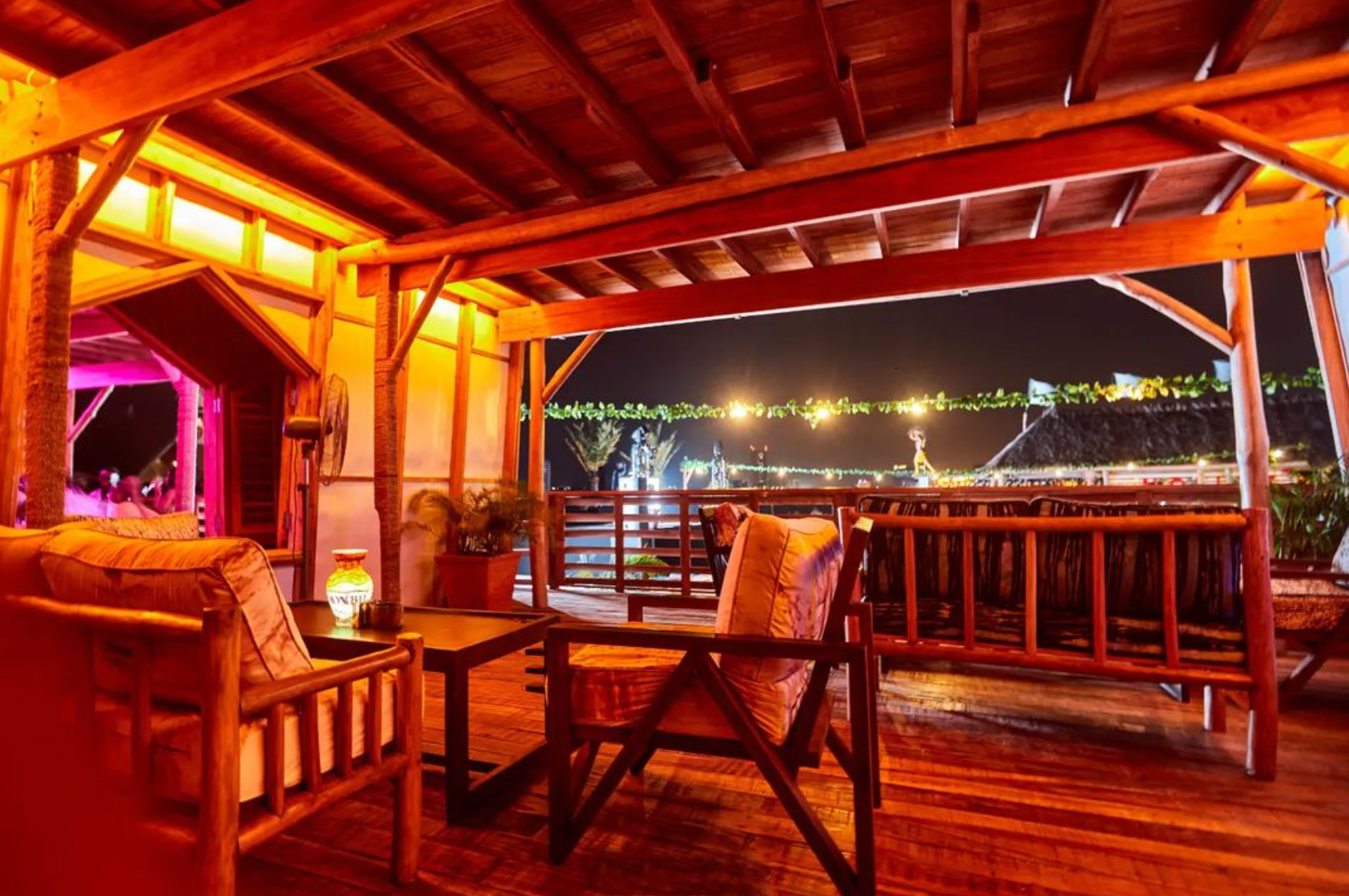 The best bars in Lagos, Nigeria | red-lit wooden interiors at Moist Beach Club