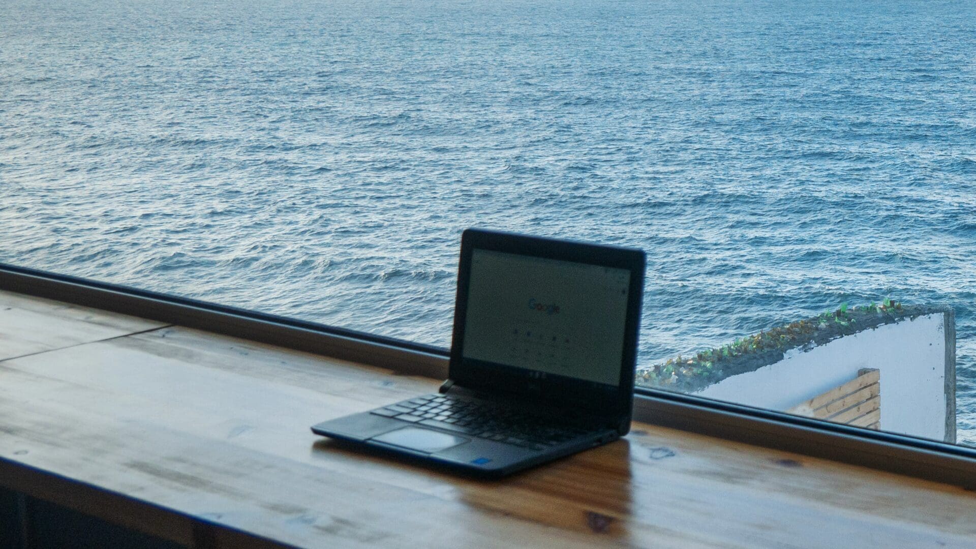 What are countries doing for digital nomads? A laptop against a view of the Atlantic Ocean