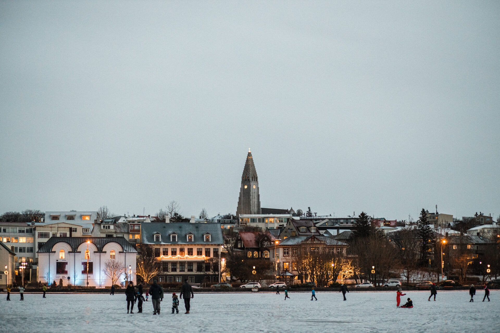 The best Christmas markets in Europe | figures walking across the snow in Reykjavik, Iceland