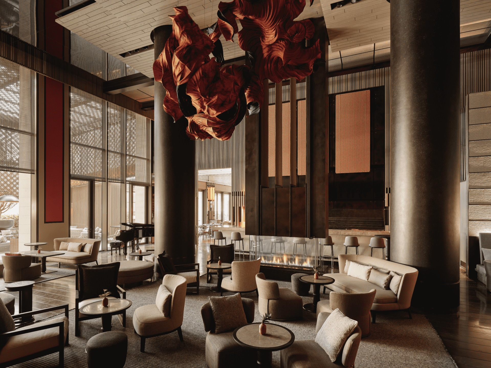 Aman hotel, New York | The bar and lounge area in neutral tones with a sculptural lighting fixture
