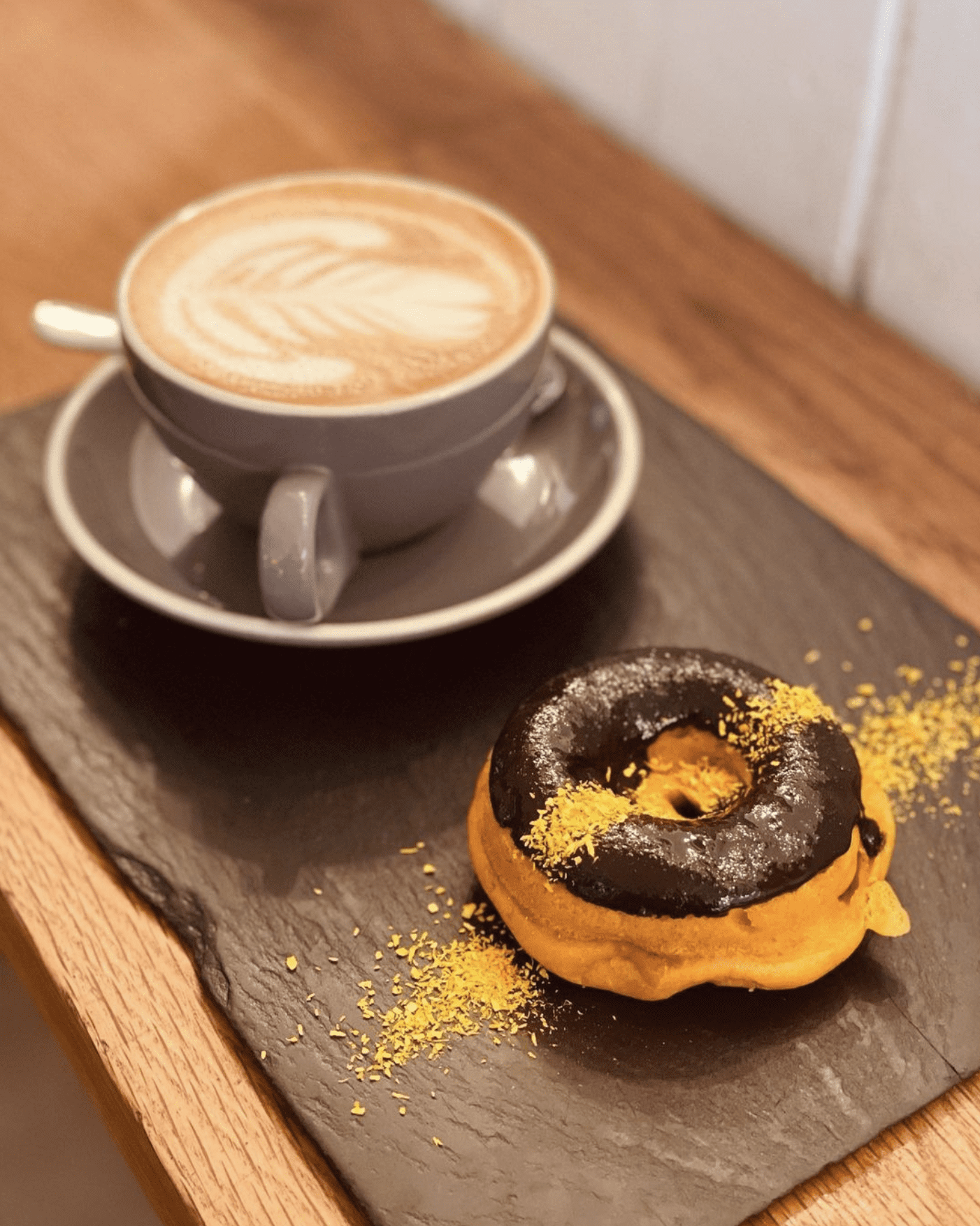 A cup of coffee and a pumpkin doughnut at Scheckter’s Raw, Sea Point