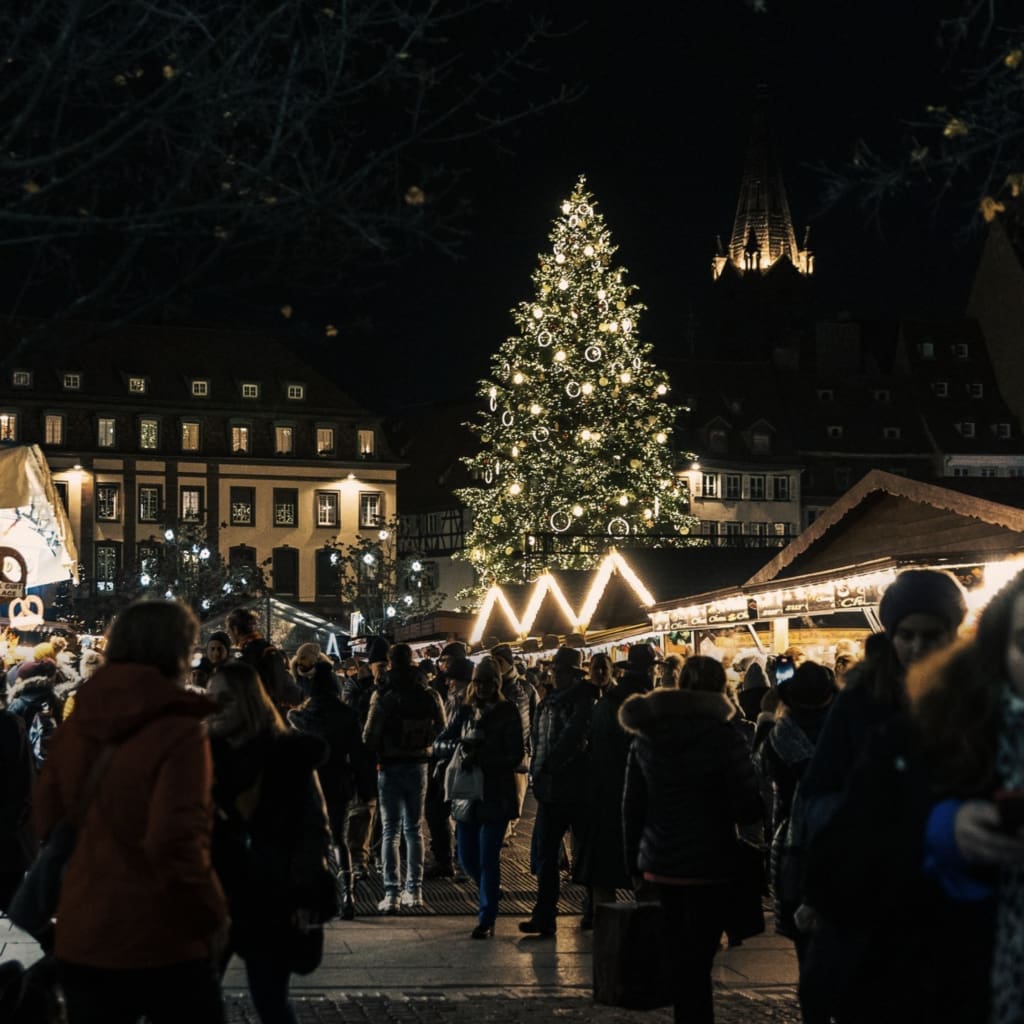The best Christmas markets in Europe | A quaint street in Strasbourg, bedecked with festive trimmings