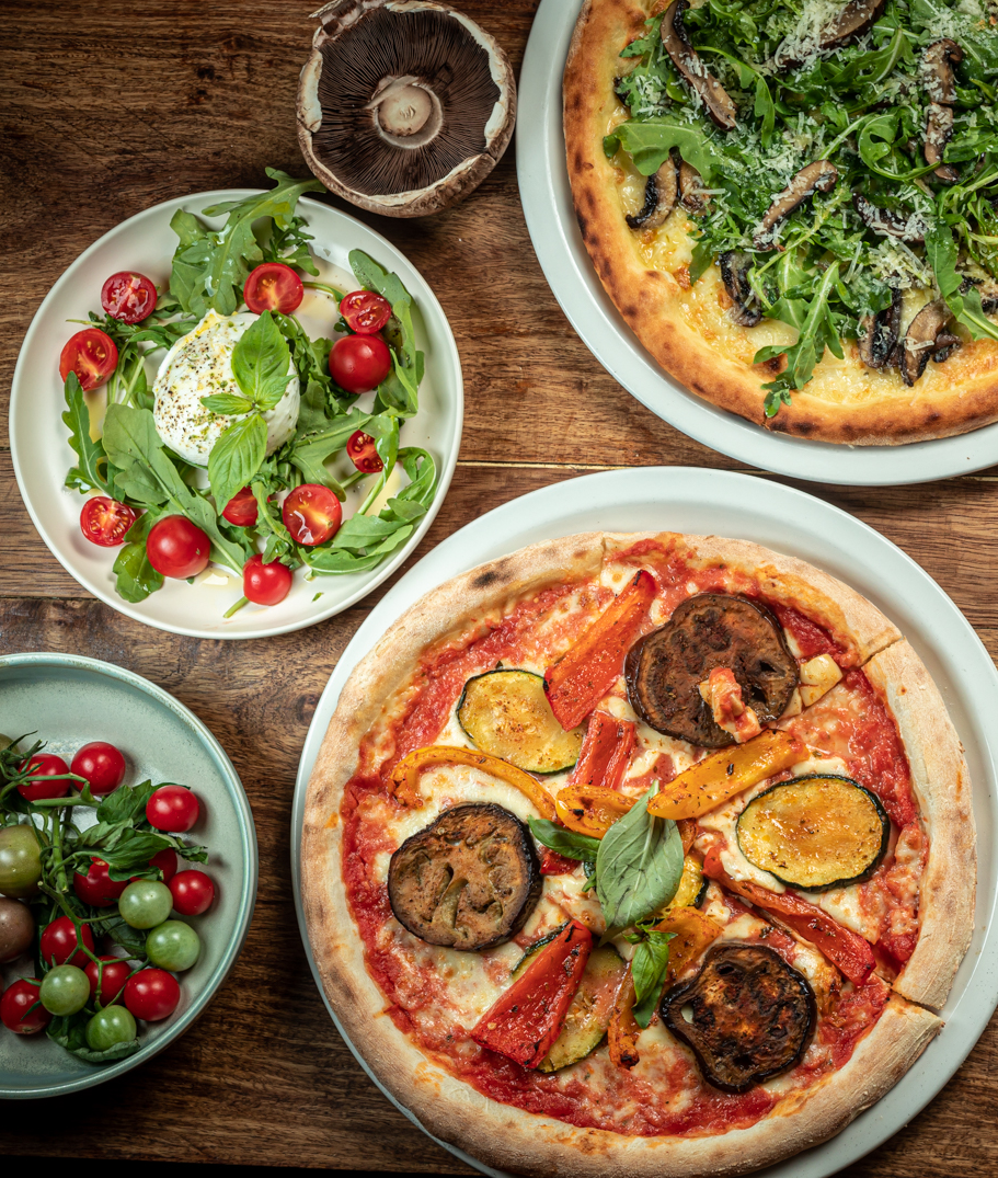The best restaurants in Brixton, South London | Pizza and salads served on a tabletop at the Agile Rabbit in Brixton