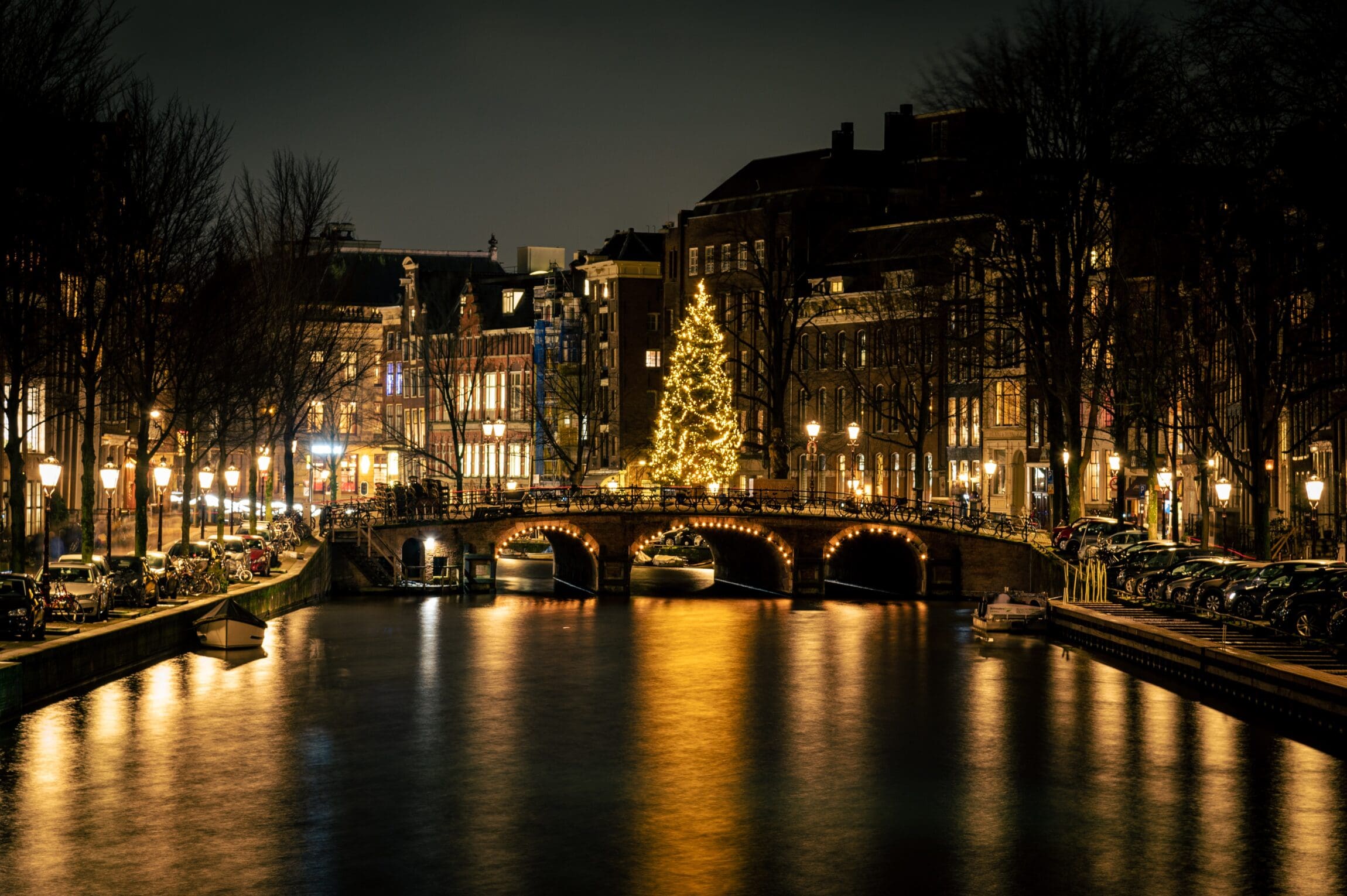 The best Christmas markets in Europe | the canal in Amsterdam at twilight