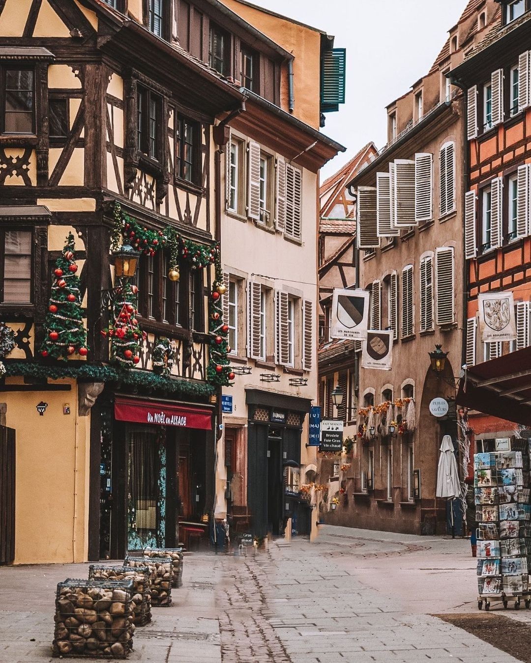 The best Christmas markets in Europe | A quaint street in Strasbourg, bedecked with festive trimmings