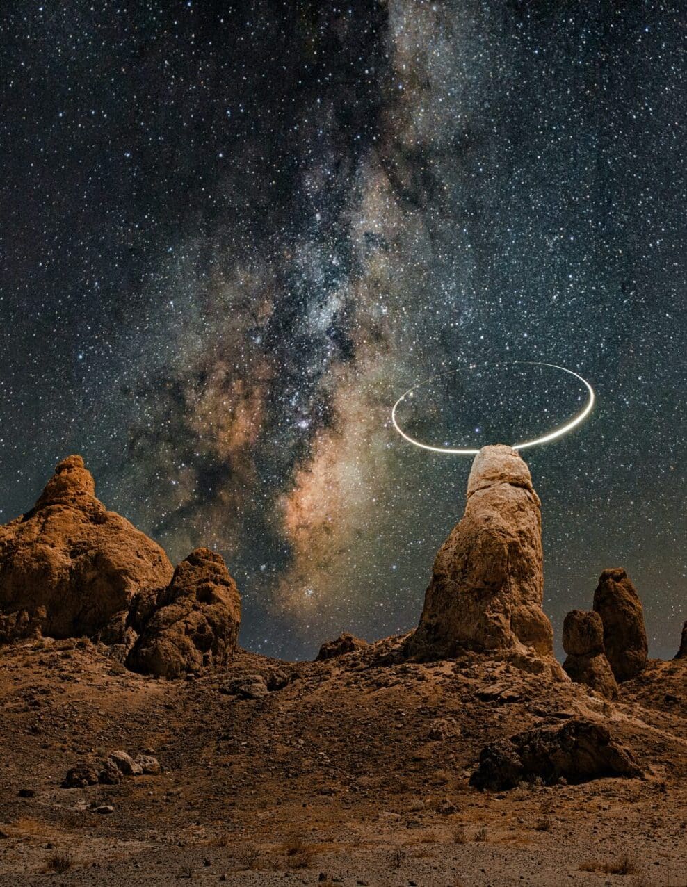 A view of space, beneath a black and blue sky dotted with stars