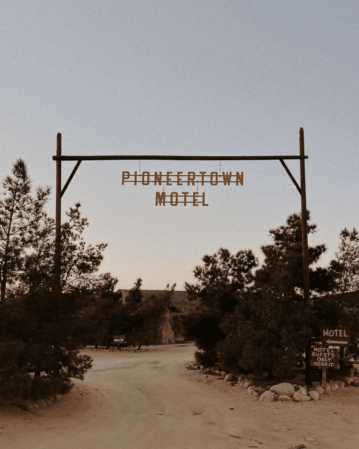 A guide to Joshua Tree, California's desert destination | The sign to Pioneertown Motel leading to a dirt path