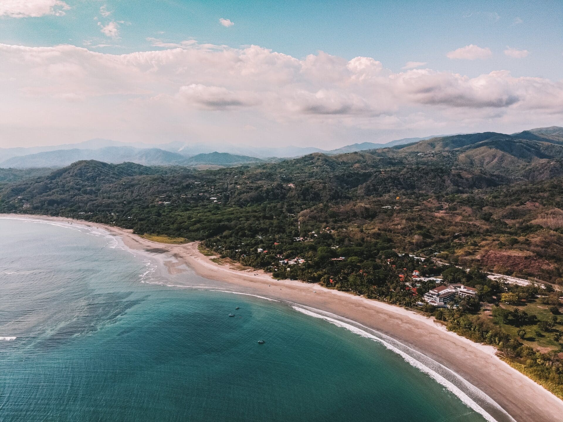 The rise of the digital nomad | A golden beach against lush forestry on the Indonesian coast line