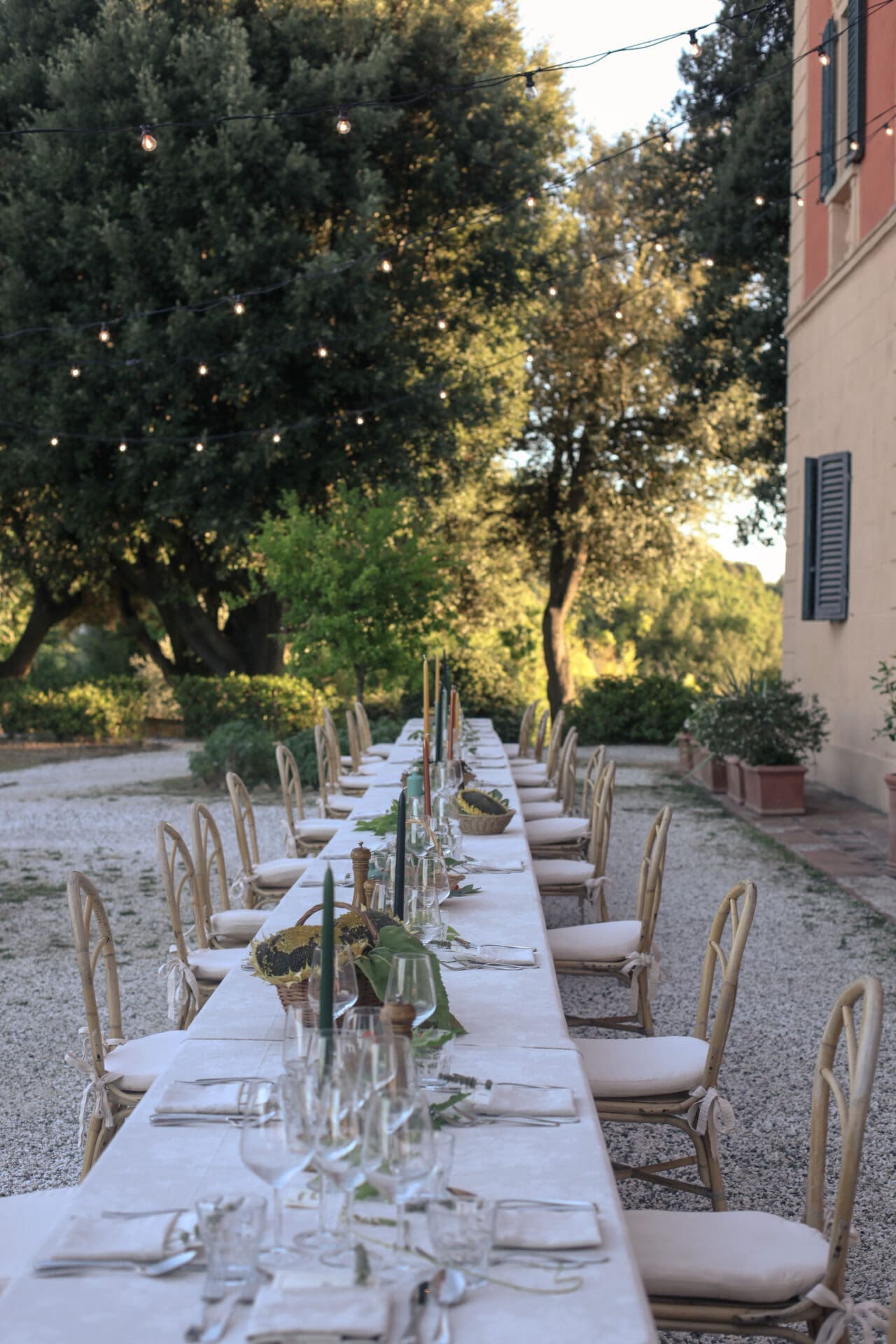 Inside Villa Lena | A long row of tables set up for an event at Villa Lena