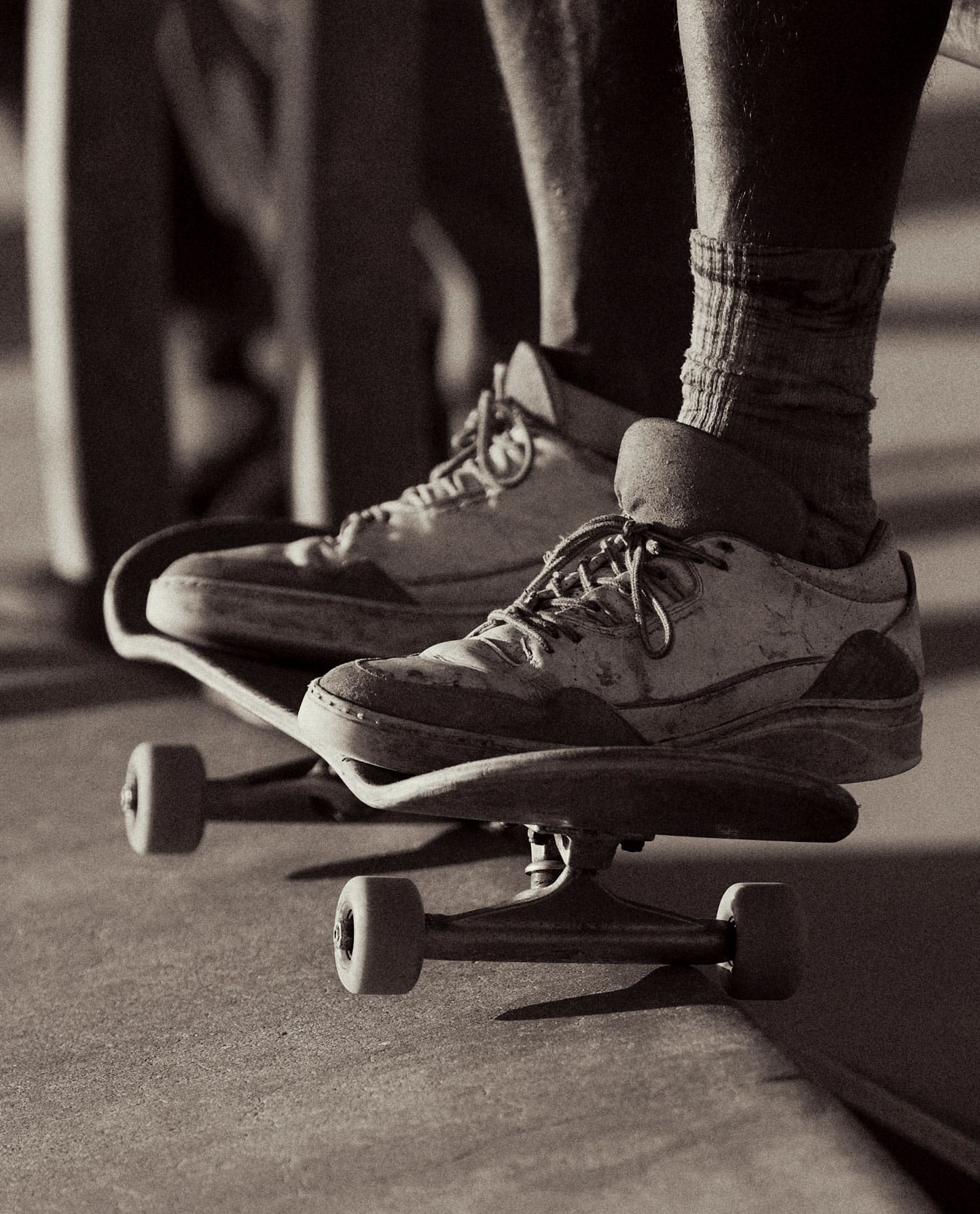 Focal Point, Erik Melvin | A detail of a skater's feet on a skateboard. Photo by Erik Melvin