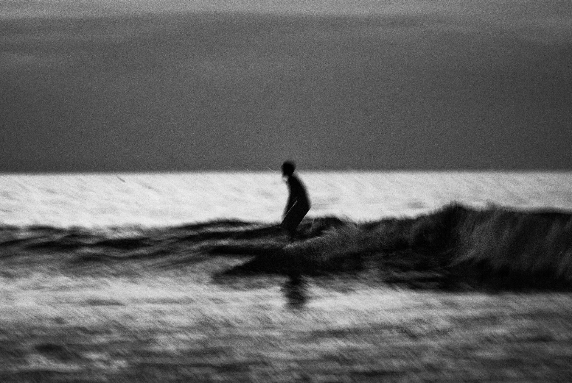 Focal Point, Erik Melvin | A black and white image of a surfer in LA. Photo by Erik Melvin