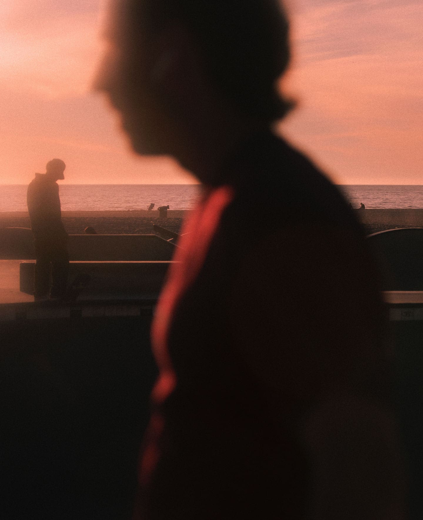 Focal Point, Erik Melvin | A figure in the foreground and the background by the coast in LA during a red sunset. Photo by Erik Melvin