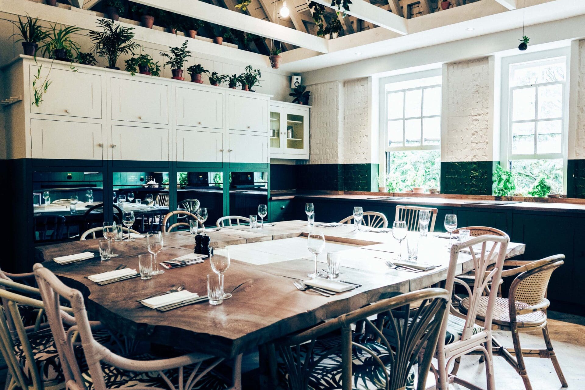 The best private dining rooms in London | Cane furniture and a wooden dining table at Bourne & Hollingsworth Buildings