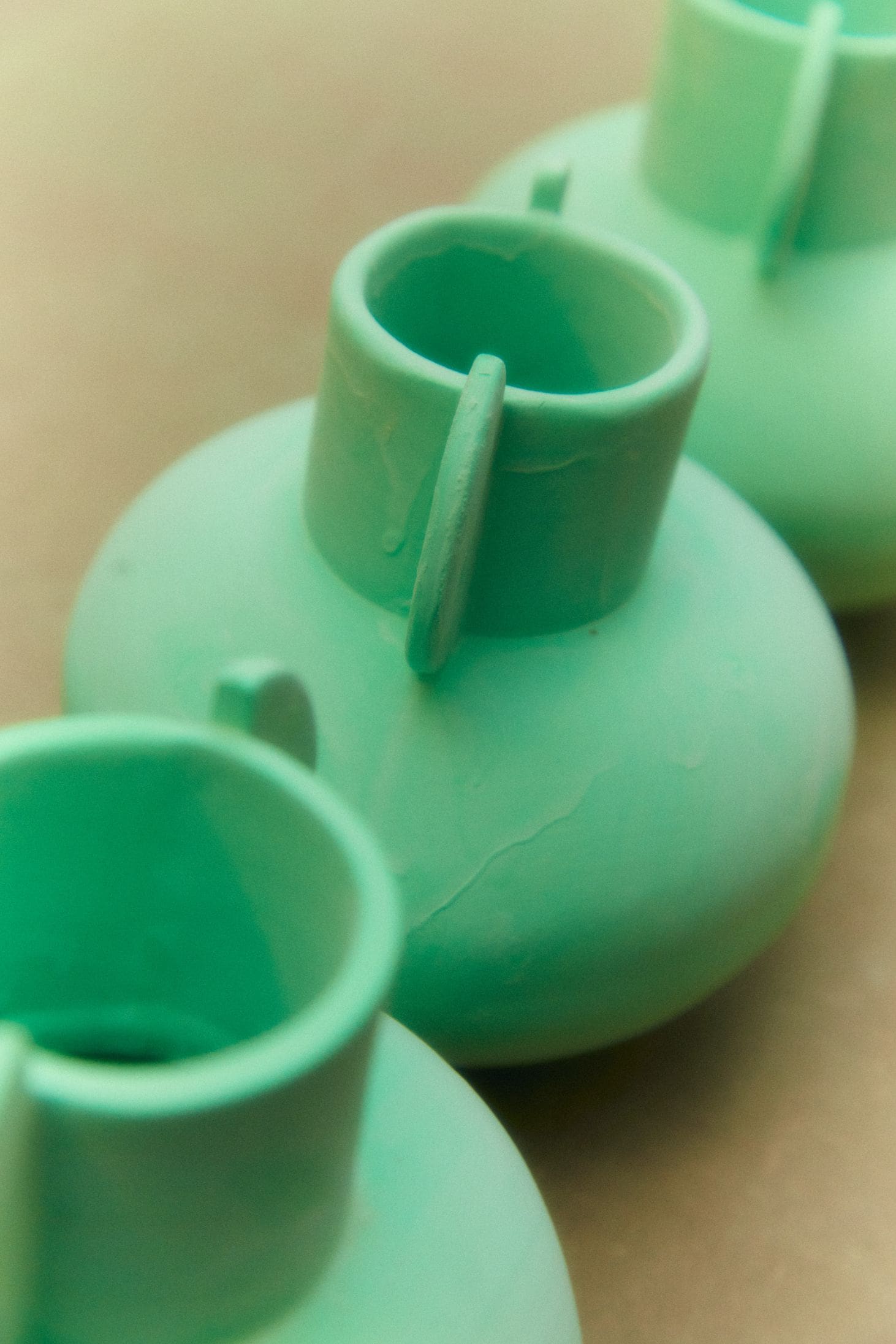 In the studio with Henry Holland | Vases freshly dipped in the bright green glaze which, once fired, becomes completely clear.