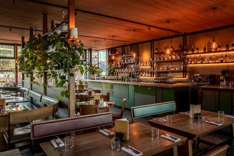The best private dining rooms in London | Contemporary touches of brushed concrete, exposed brick and gold detailing, contrast with the black brick exterior at The Lighterman