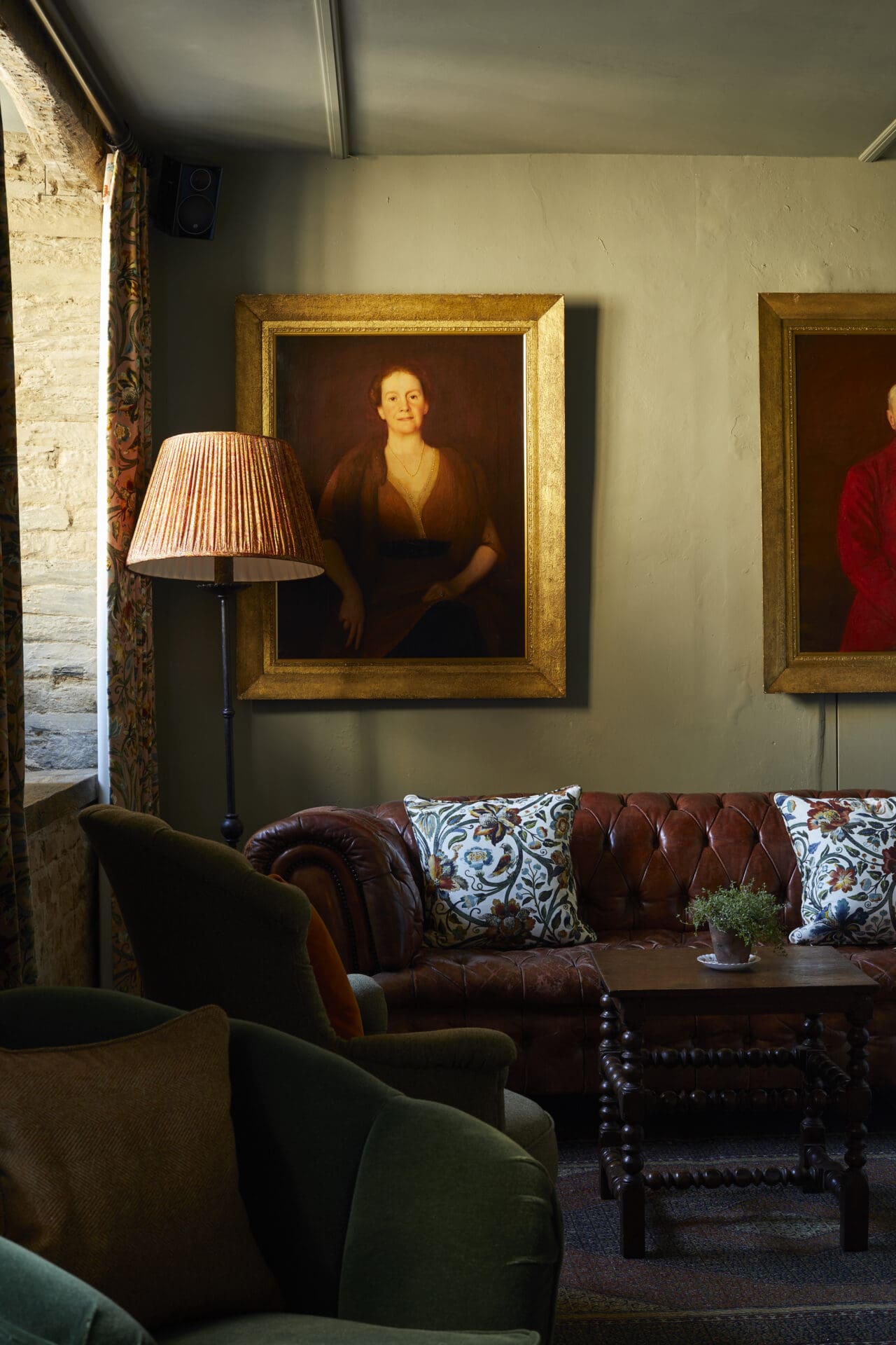 The Pig Hotel, UK | oxblood leather sofas and dark green armchairs