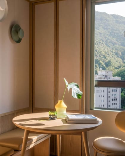 The Ying’nFlo hotel opens in Hong Kong | flowers on a wooden table in natural light