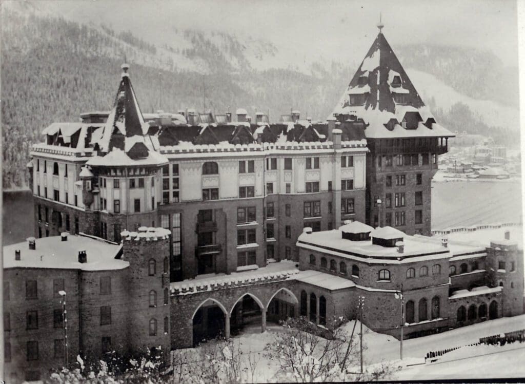 The most spectacular places to stay in the Alps this winter | An old black and white photo of Badrutt's Palace in St Moritz