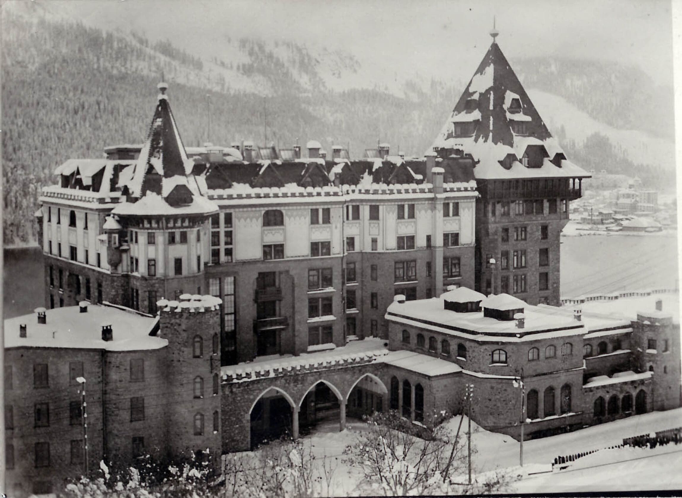 An old black and white photo of Badrutt's Palace in St Moritz
