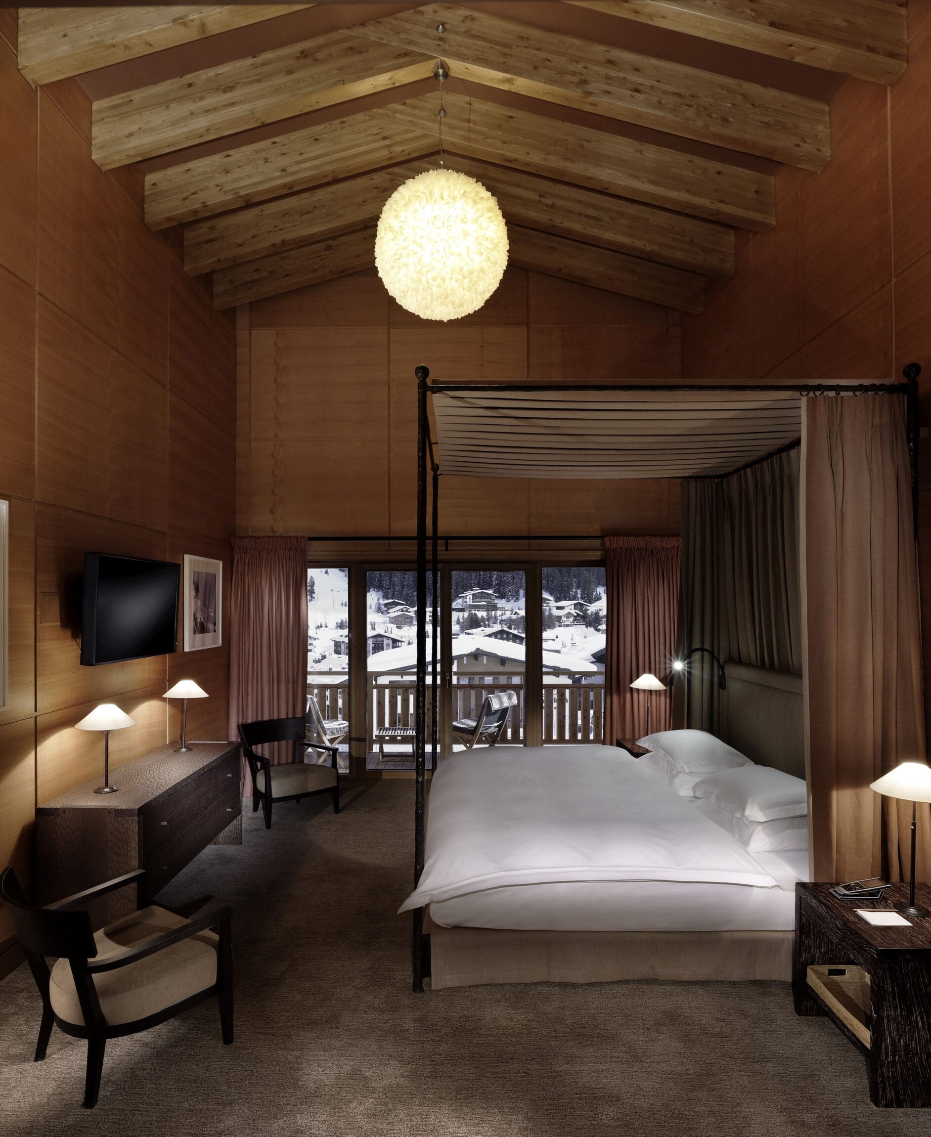 The most spectacular places to stay in the Alps this winter | Inside a cosy bedroom in Hotel Aurelio