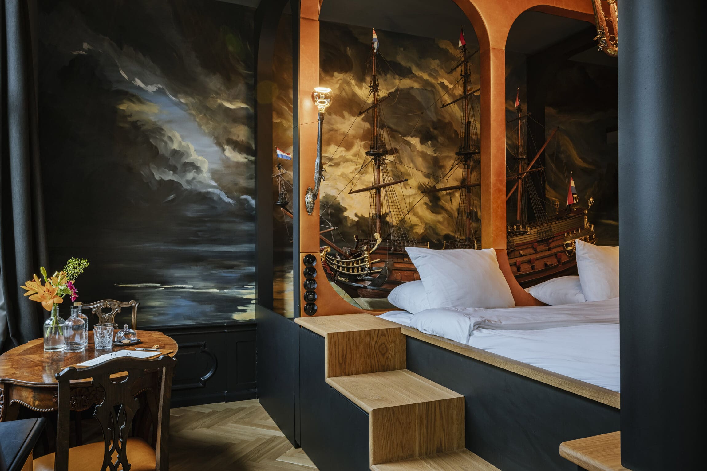 The best hotels in Amsterdam | The Nobleman in has a painting of a ship behind the bed