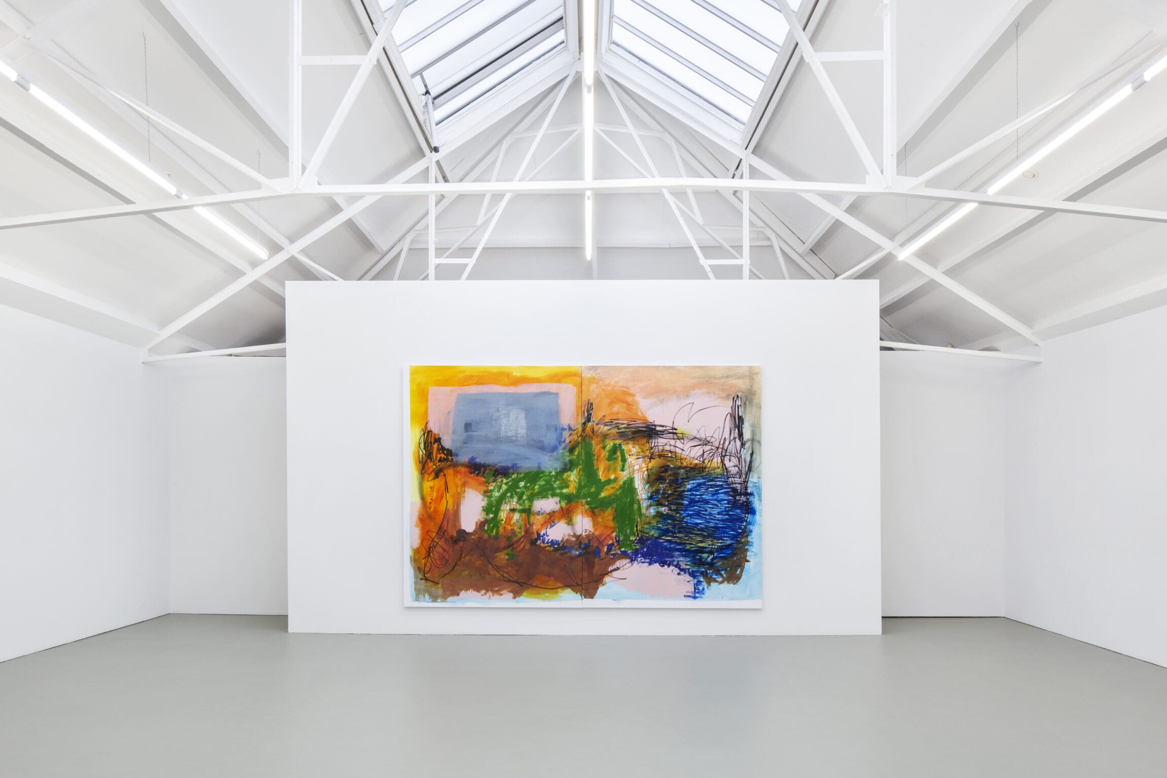 The best museums and art galleries in Amsterdam | Large colourful artwork against a white walled gallery with a soaring pitched roof