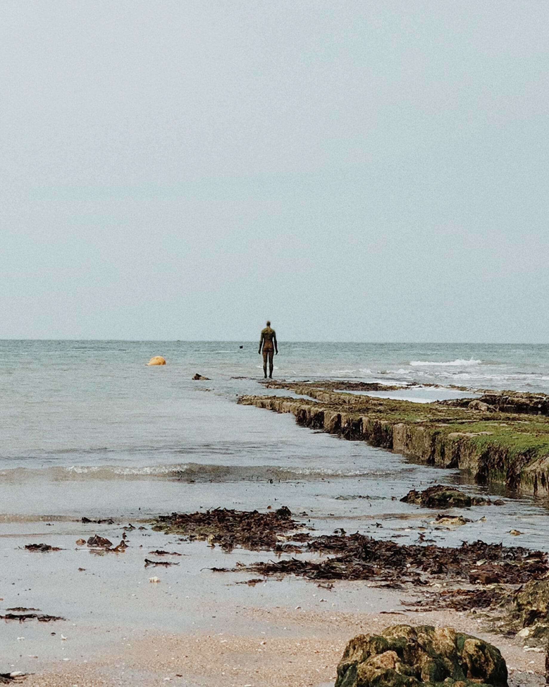 Kent Coastline | The Kent coastline with somebody standing at the edge of the water
