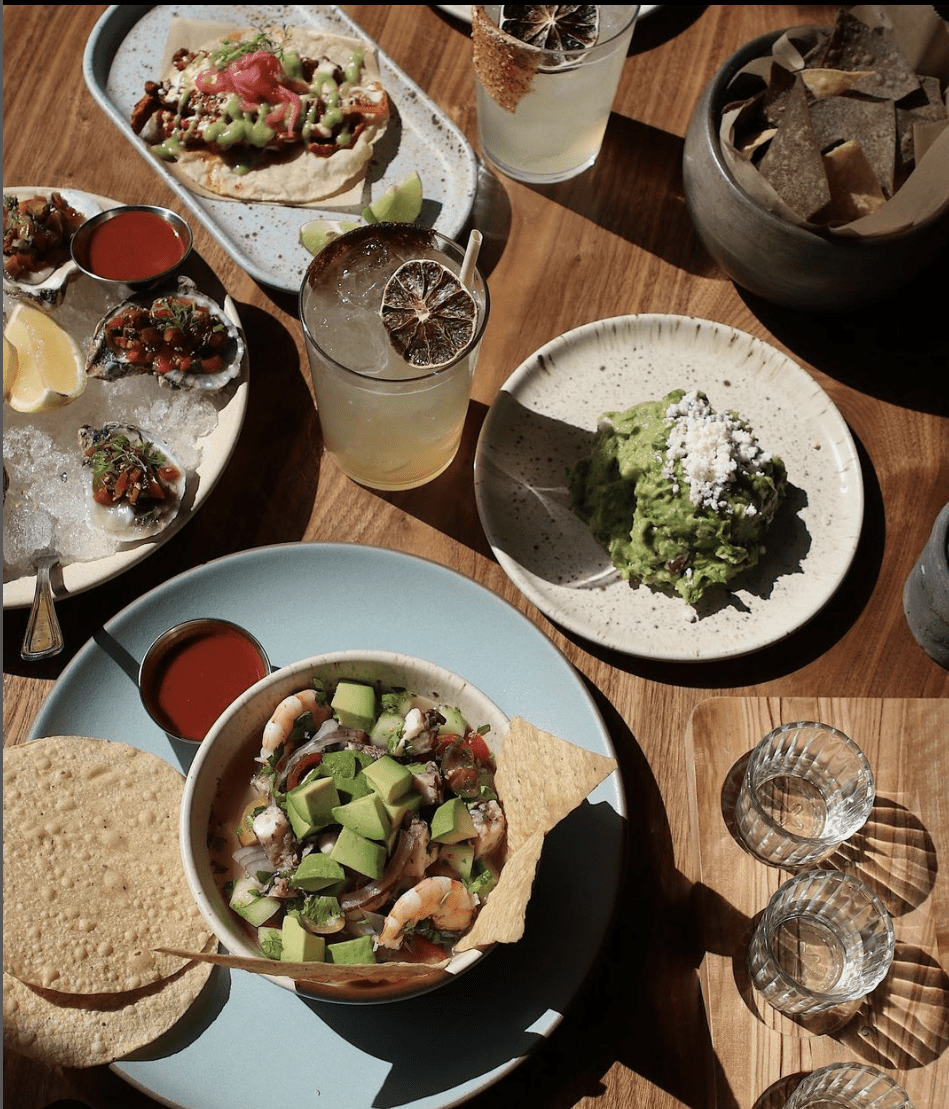 The best restaurants in LA | Aerial view of Mexican-inspired dishes, with tortillas and avocado, at Madre