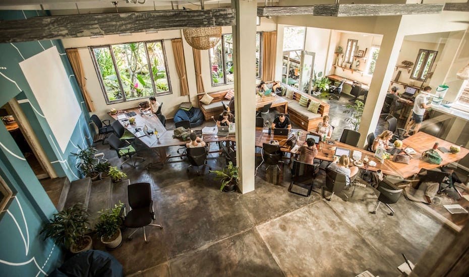 The rise of the Slomad | an open plan co-working space in Ubud, Bali, with computer desks against tropical views