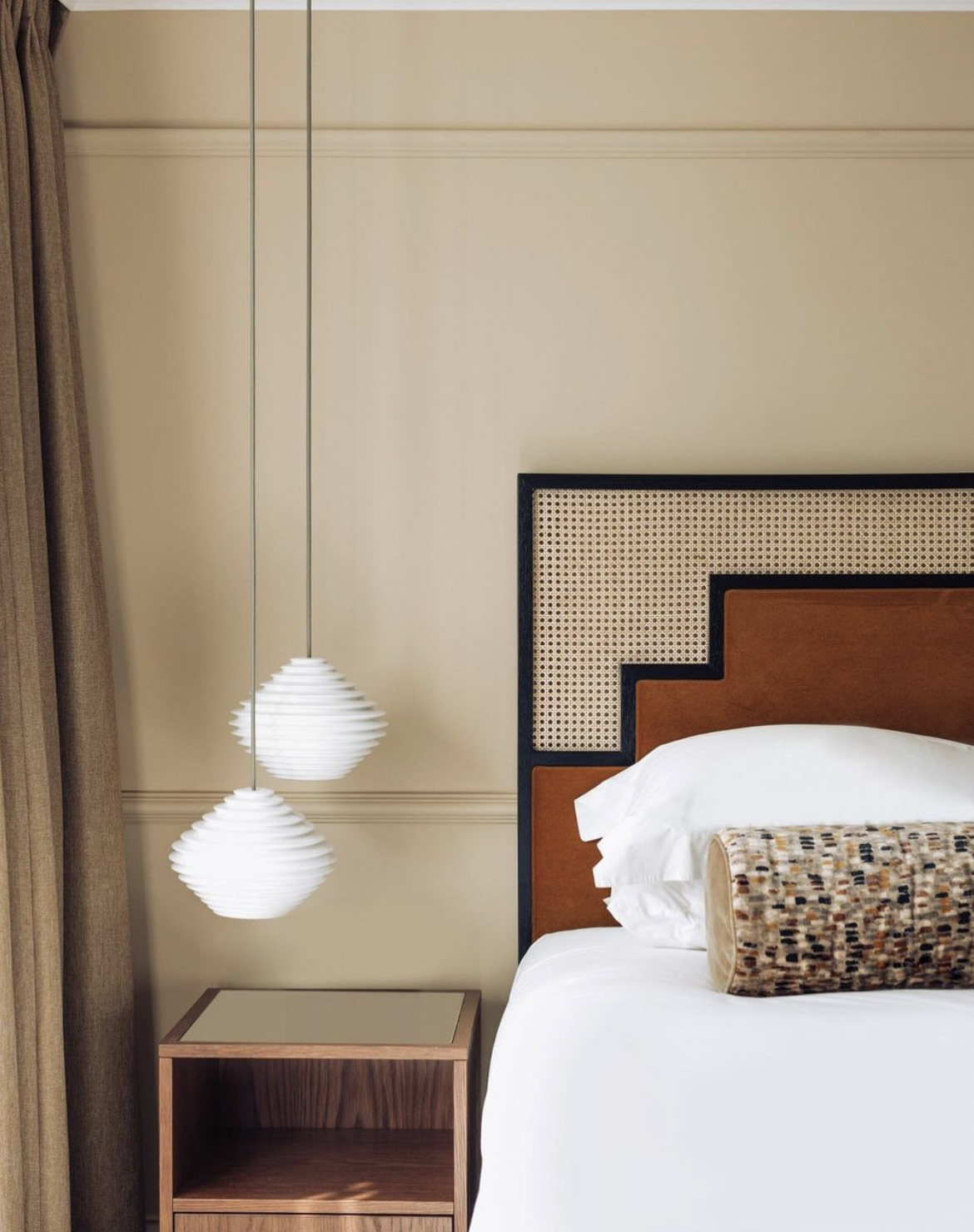 The Lost Poet, Notting Hill London | A white bed with a statement headboard
