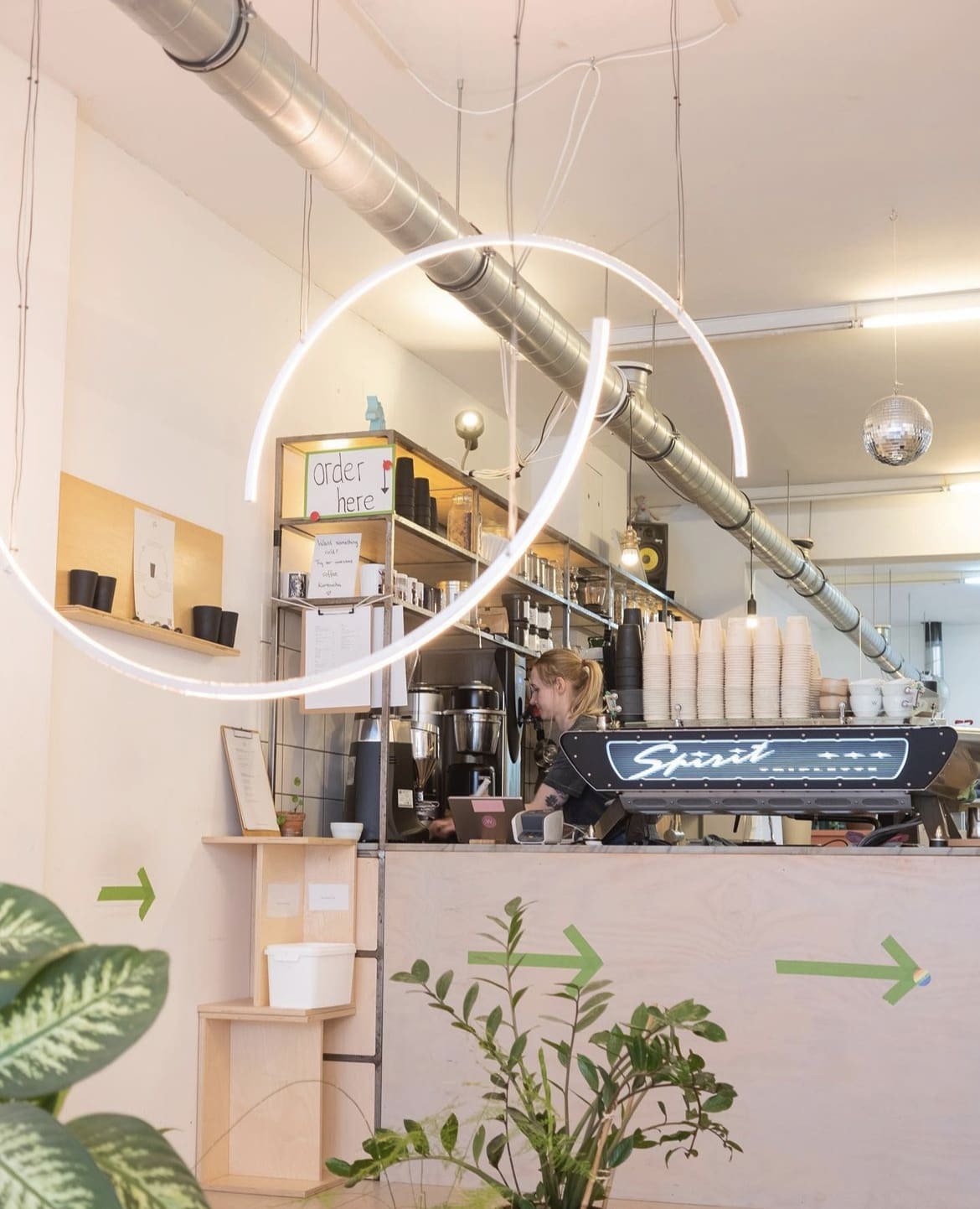 The best cafes in Amsterdam | White Label Coffee in tones of pink with plants in view